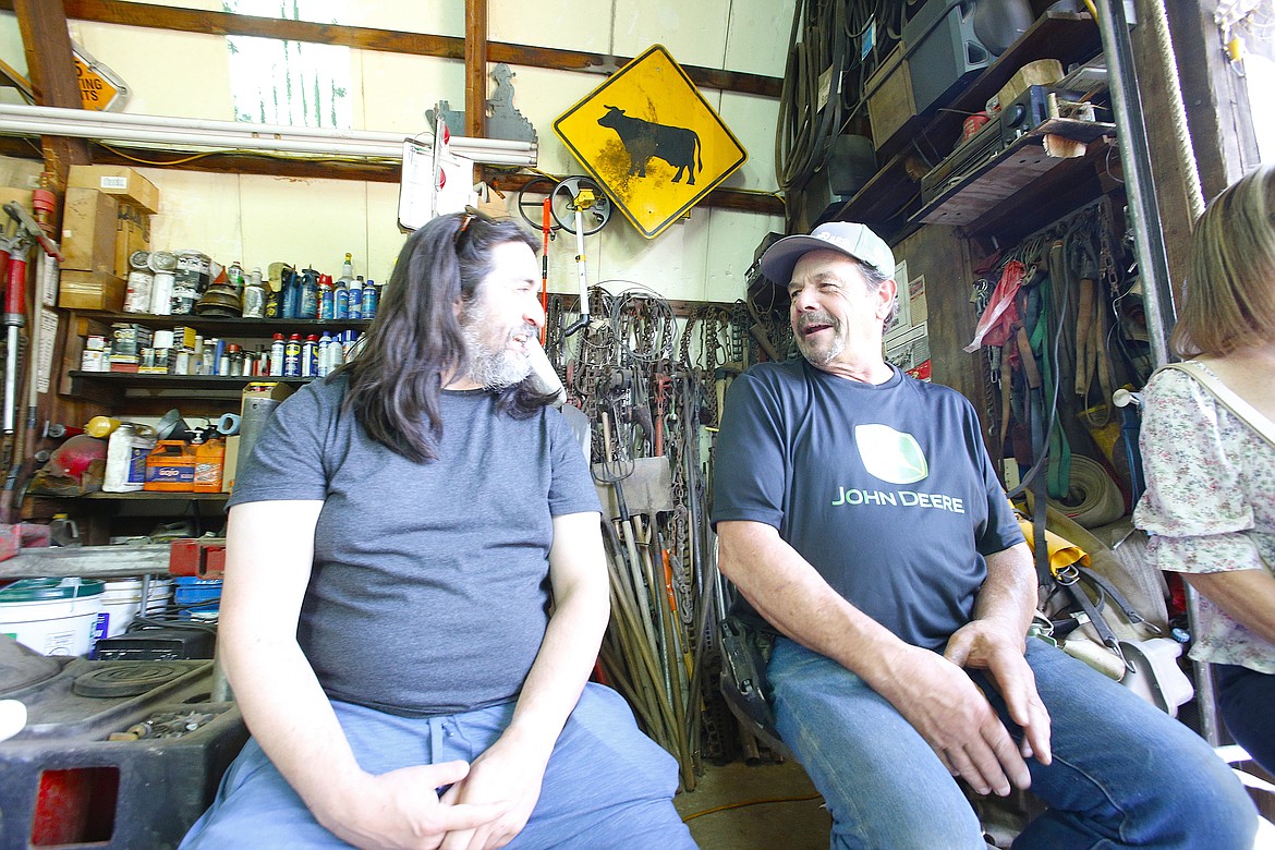 Laurin Scarcello, right, visits July 20 with cousin Andrew Dempsey during the biennial celebration of the Scarcello ranch, established in 1910.