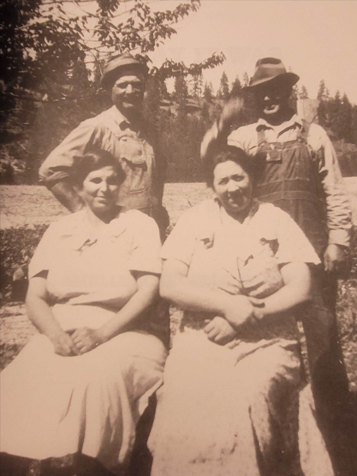 The Scarcello ranch in Rathdrum was founded in 1910 by four brothers from a small village in Italy. The ranch is still owned and operated by their descendants. Back row, from left: Frank and Tony Scarcello. Seated, from left: Frank's wife Angelina and Tony's wife Josephine.