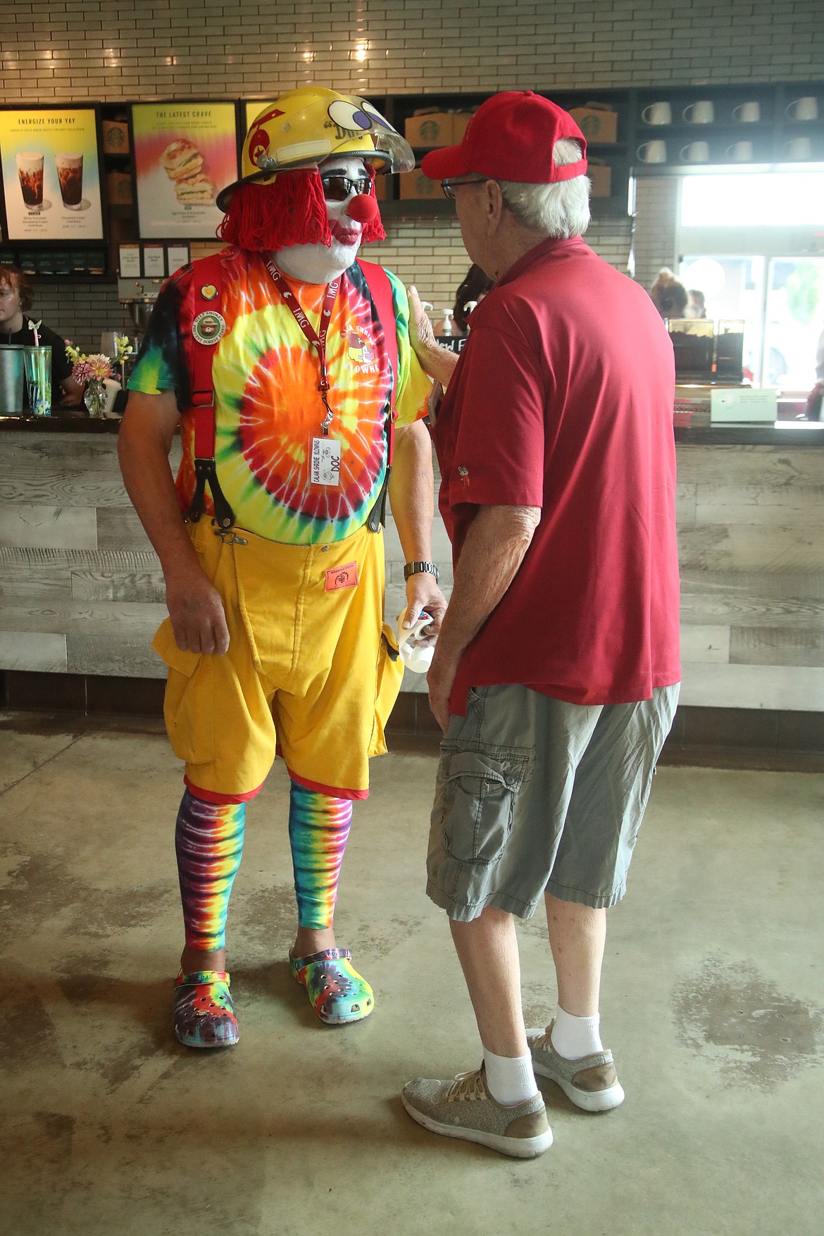 Chuck "Doc" Schoonover, left, talks to a fellow Shriner.