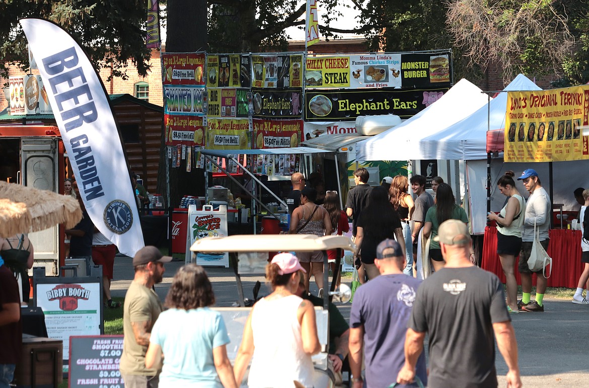 Crowds head to Taste of Coeur d'Alene at City Park on Friday.