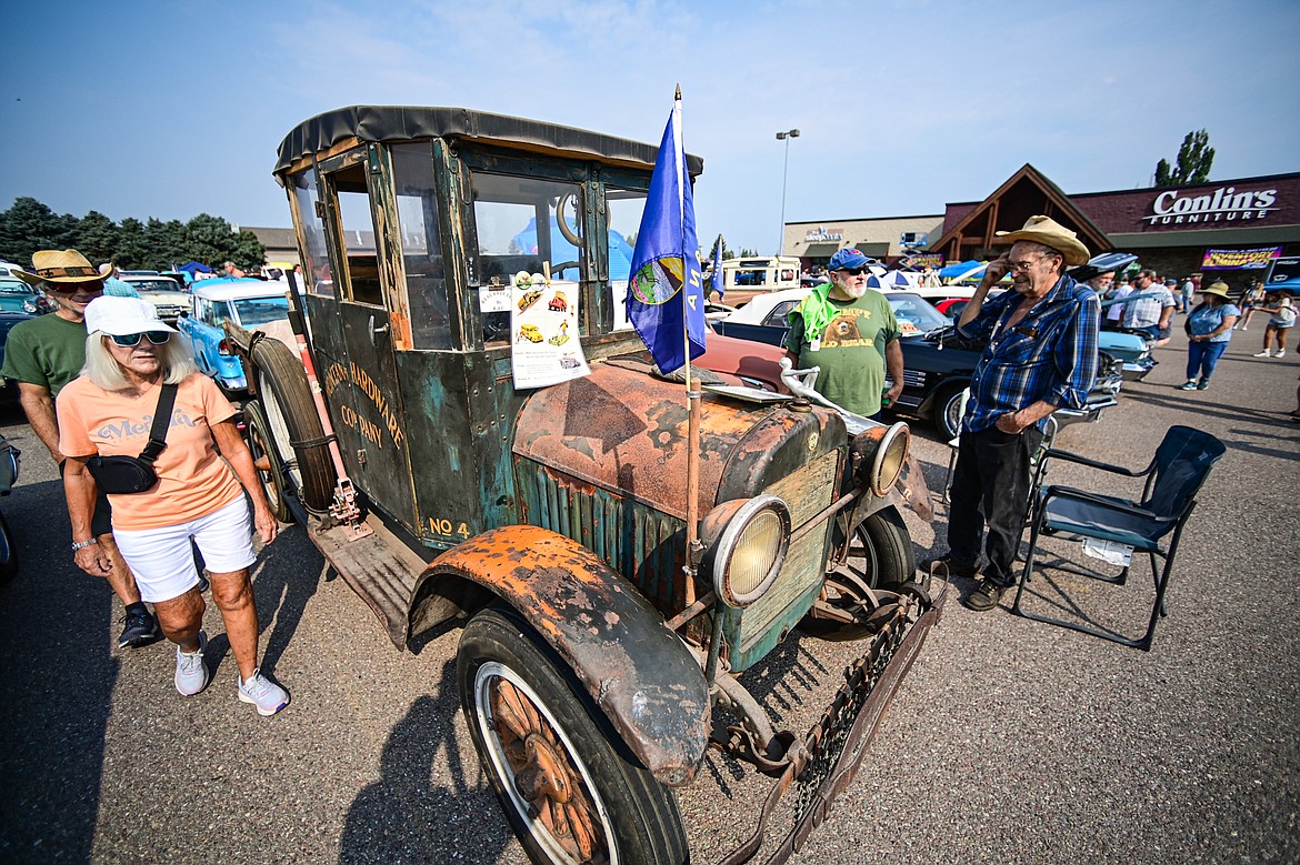 Visitors check out a 1926 REO Speedwagon at the Evergreen Show 'N Shine at Conlin's Furniture on Saturday, Aug. 3. (Casey Kreider/Daily Inter Lake)