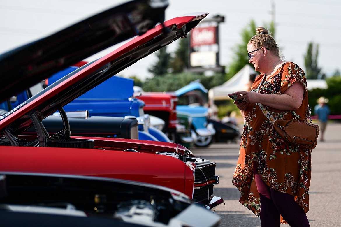 Visitors check out rows of classic cars, trucks, motorcycles and off-road vehicles at the Evergreen Show 'N Shine at Conlin's Furniture on Saturday, Aug. 3. (Casey Kreider/Daily Inter Lake)