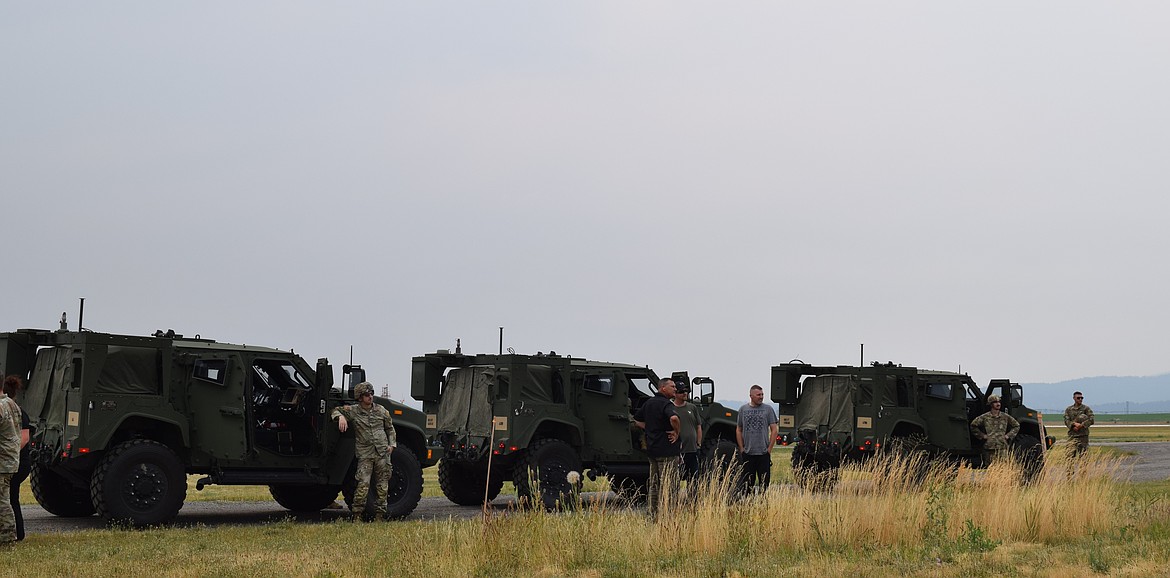 A JLTV convoy lines up at Coeur d'Alene airfield.