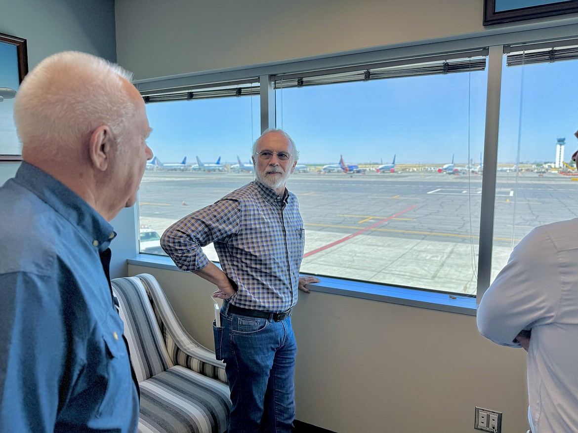 Congressman Dan Newhouse, back, talks with Port of Moses Lake Commissioner Kent Jones, foreground, during a Thursday visit to the port.