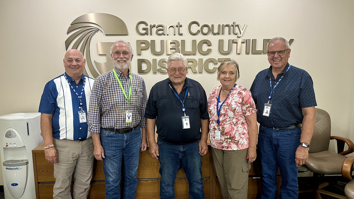 Dan Newhouse, second from left, with Grant County PUD commissioners, from left, Terry Pyle, Tom Flint, Judy Wilson and Larry Schaapman.