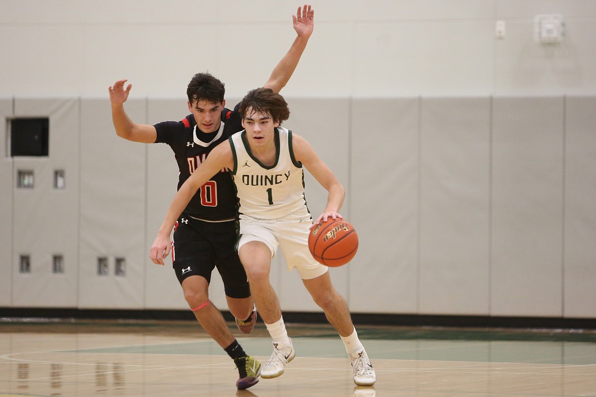 Jackrabbit rising junior Pierce Bierlink brings the ball up the floor during a league game against Omak last season.