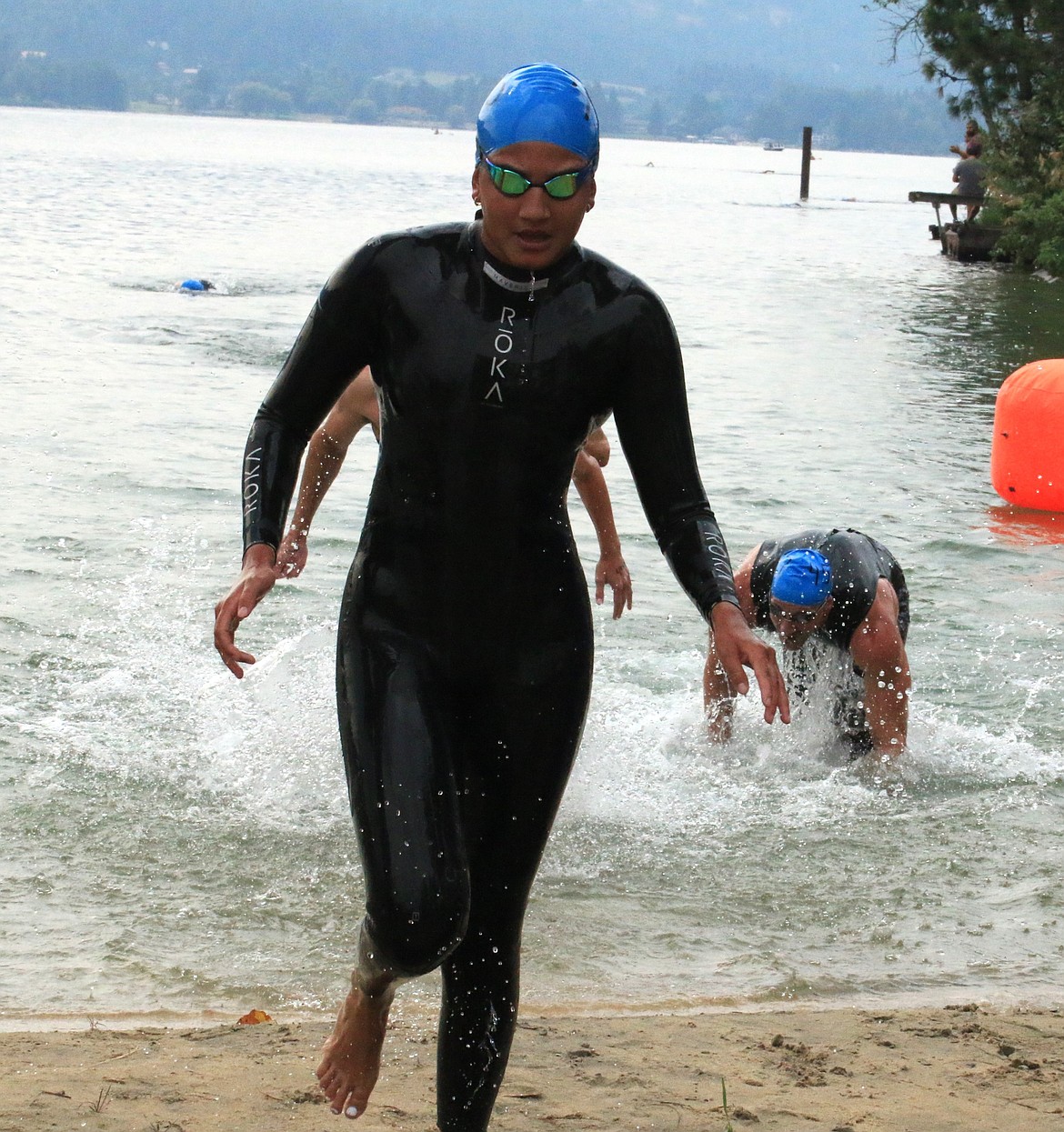 MAX OSWALD/Bonner County Daily Bee
Lake City High's Pema Anain crosses the finish line as the first female, and second place finisher overall in Saturday's Long Bridge Swim in Sandpoint.