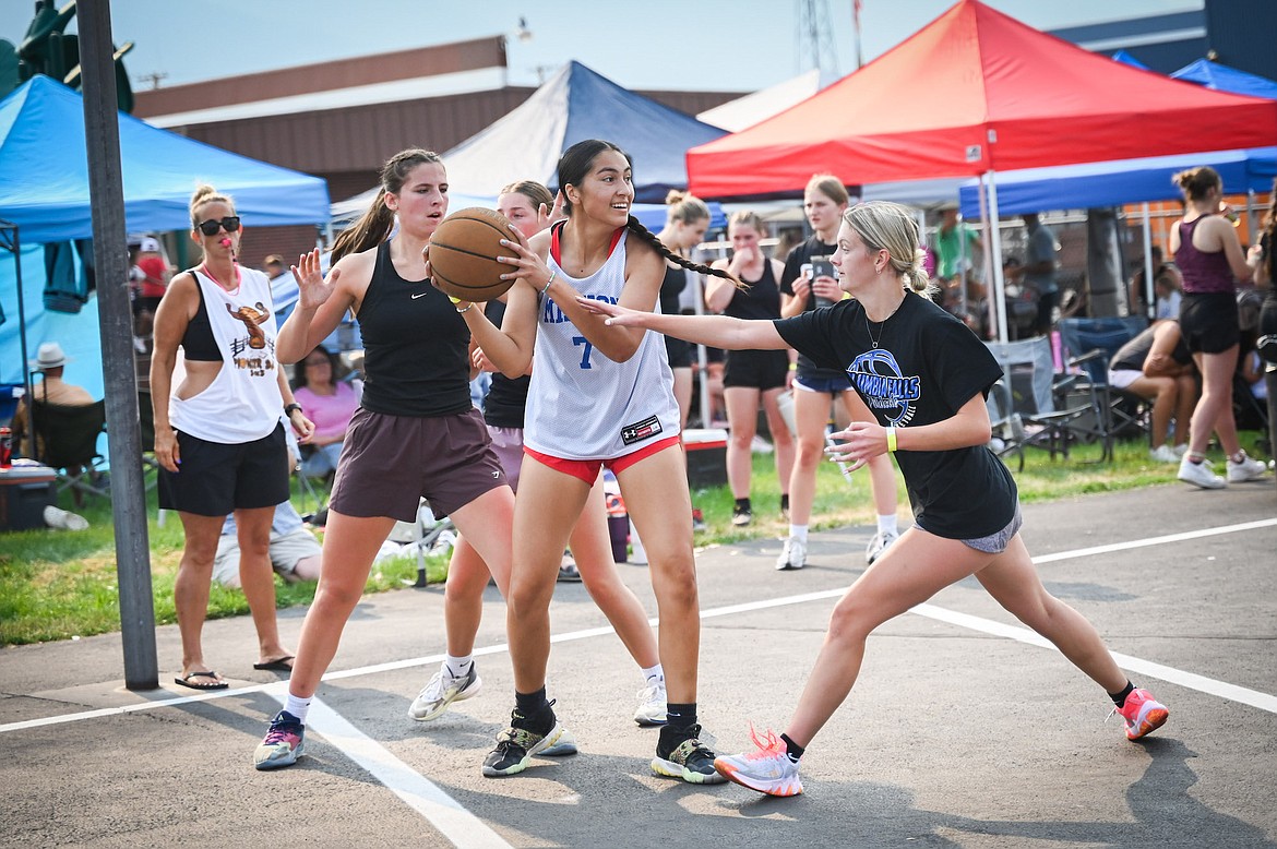 Cora Matt, whose team topped her age division, plays keep-away during the annual 3-on-3 Jamboree in Ronan. (Christa Umphrey photo)