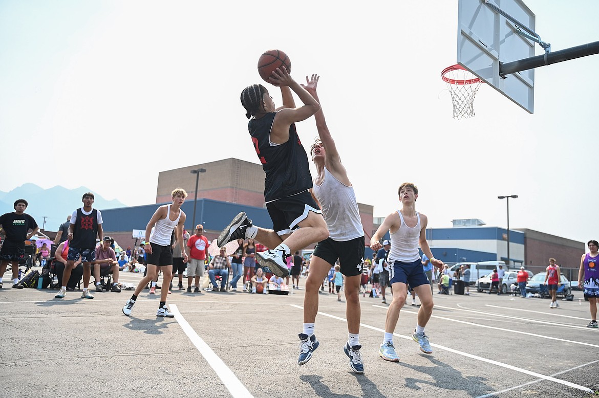 Lex LaFrombois goes up for a shot during Saturday's 3-on-3 Jamboree in Ronan. The annual Pioneer Days event drew more than 100 teams. (Christa Umphrey photo)