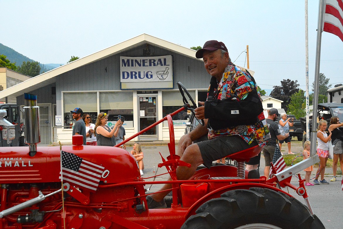 Even with a bum shoulder, Curtis Mintz of St. Regis still participated in the vintage tractor brigade on Saturday. (Mineral Independent/Amy Quinlivan)