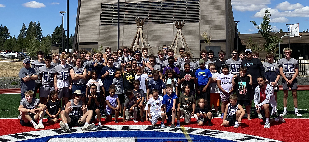 Courtesy photo
Lake City High football players and coaches pose with incoming elementary and middle school students from the Plummer/Worley area at a camp held July 31 at the Marimn Health Coeur Center in Worley. The camp was organized by Jerry Louie-McGee, who played at Lakeside High in Plummer as a freshman before transferring to Lake City. Louie-McGee, now the head football coach at Lakeside, teamed up with Lake City coaches and players to put on the camp.