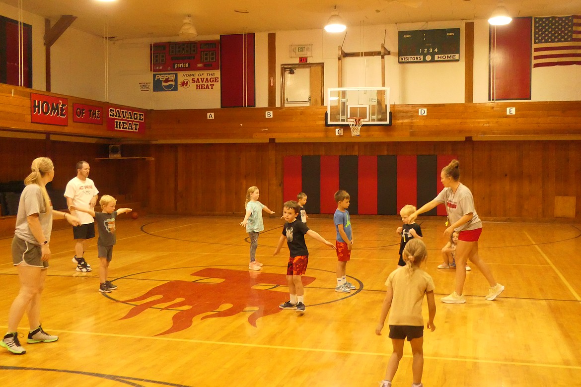 Hot Springs Basketball Camp director Maria Begger conducts a drill during last week's K-8 basketball camp in Hot Springs.  (Chuck Bandel/VP-MI)