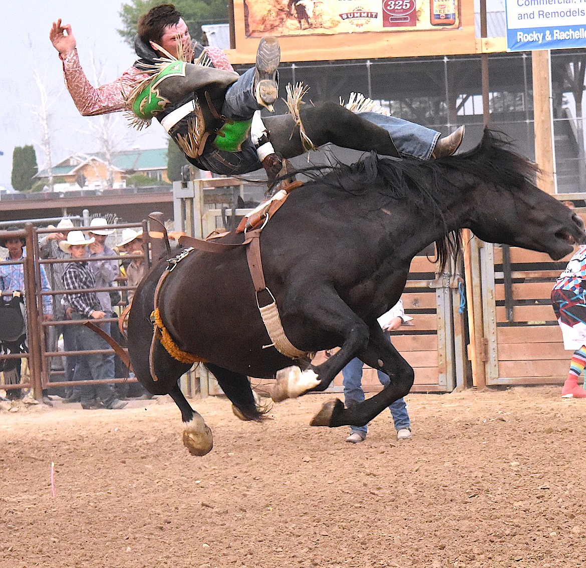 Dallas Deyer's bareback bronc has quite a vertical leap at the Ronan Pioneer Days Rodeo. (Berl Tiskus/Leader)