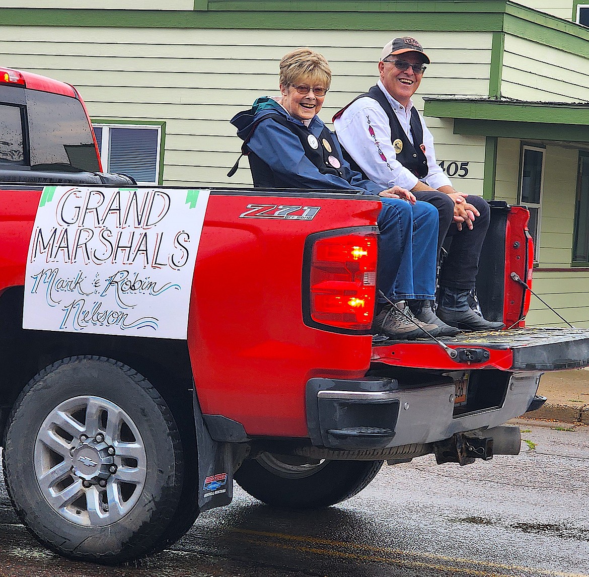 Pioneer Parade Grand Marshals Robin and Mark Nelson wave at friends and neighbors along the parade route. (Berl Tiskus/Leader)