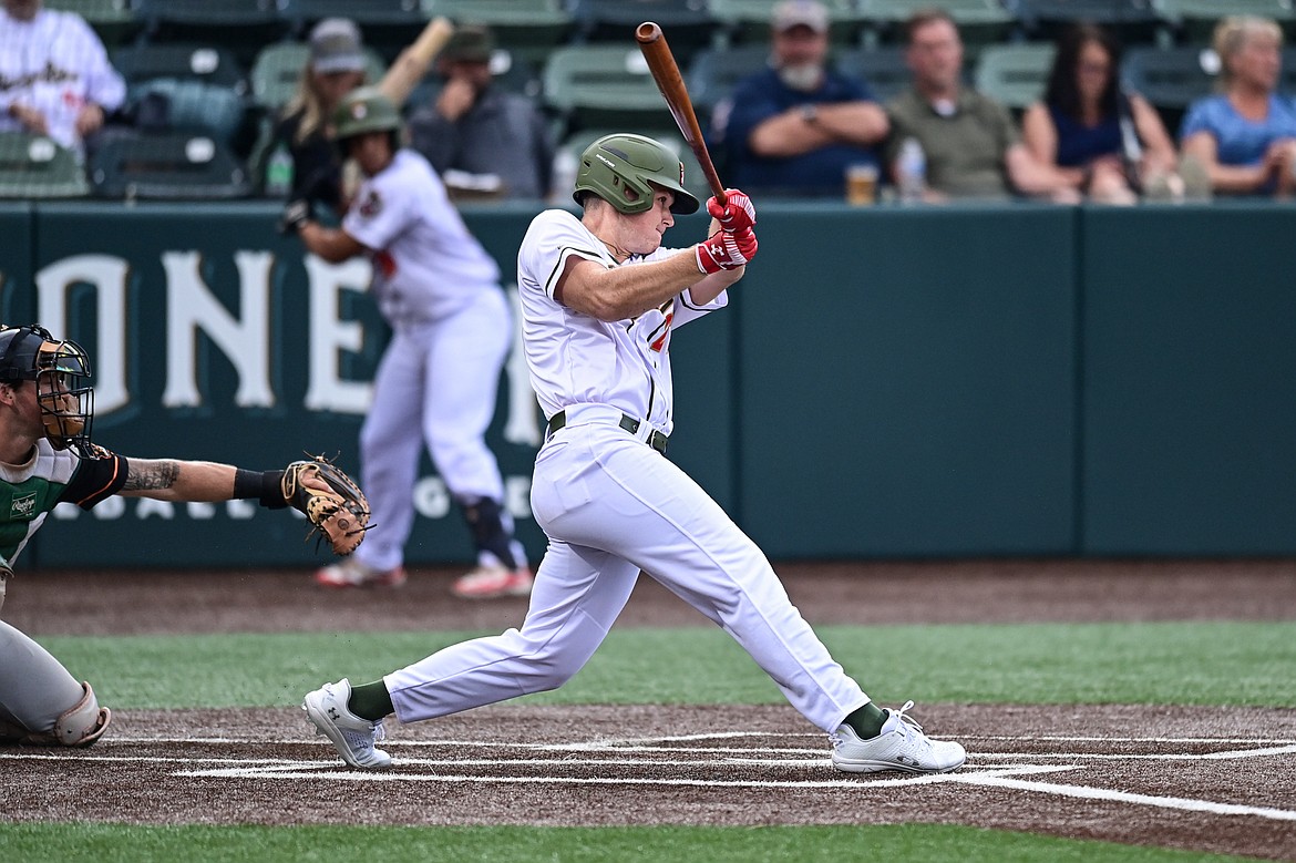 Glacier's TJ Clarkson (27) singles in the fifth inning against the Missoula Paddleheads at Glacier Bank Park on Tuesday, Aug. 6. (Casey Kreider/Daily Inter Lake)