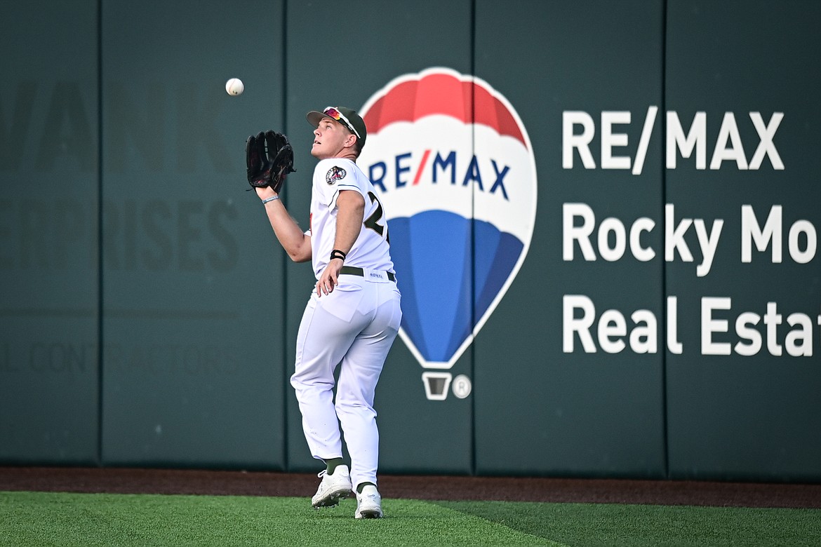 Glacier right fielder TJ Clarkson (27) catches a fly ball at the warning track against the Missoula Paddleheads at Glacier Bank Park on Tuesday, Aug. 6. (Casey Kreider/Daily Inter Lake)