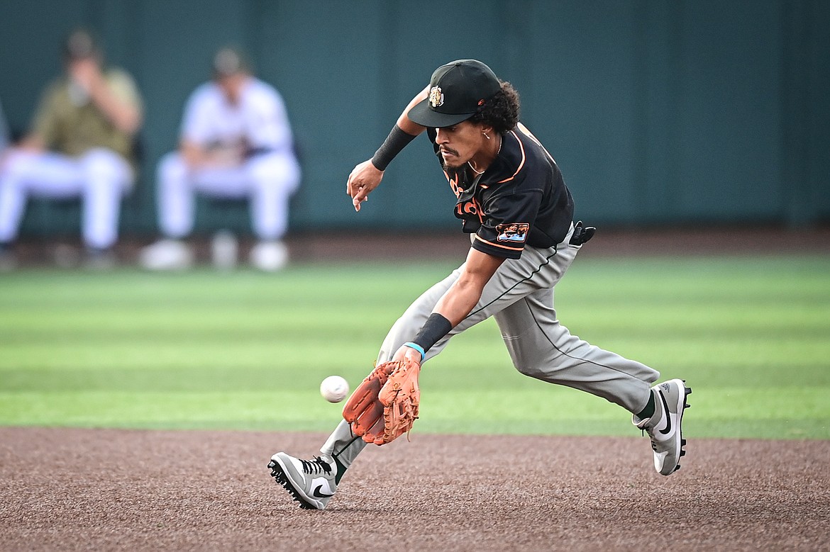 Missoula shortstop Kamron Willman (2) charges a grounder against the Glacier Range Riders at Glacier Bank Park on Tuesday, Aug. 6. (Casey Kreider/Daily Inter Lake)