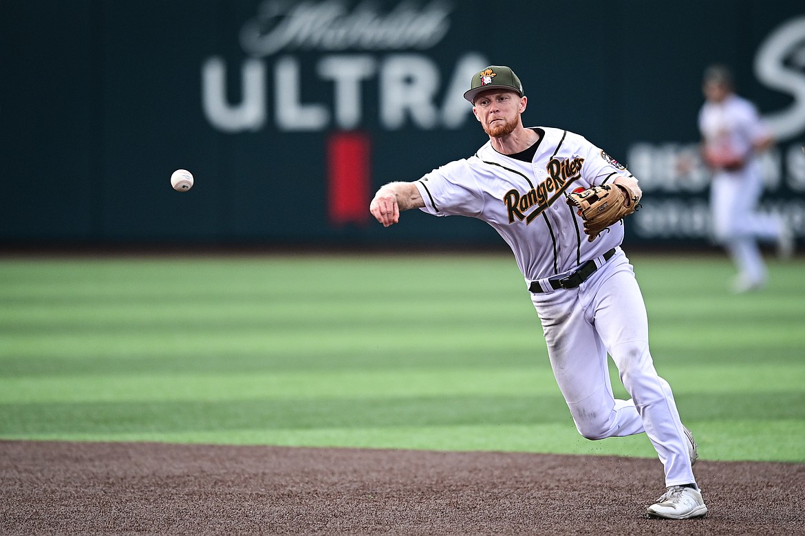 Glacier shortstop Andy Atwood (21) fires to first base for an out against the Missoula Paddleheads at Glacier Bank Park on Tuesday, Aug. 6. (Casey Kreider/Daily Inter Lake)