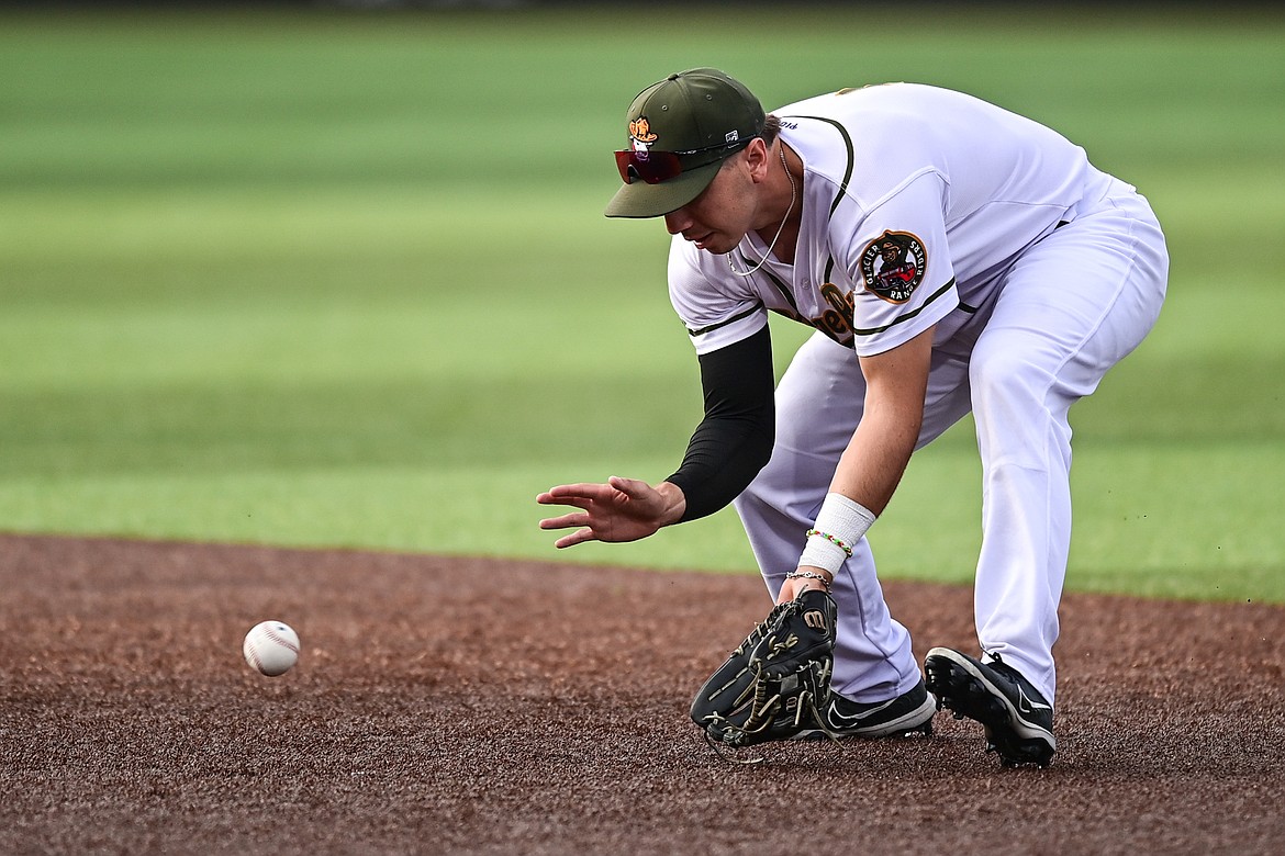 Glacier second baseman Christian Kirtley fields a grounder for an out against the Missoula Paddleheads at Glacier Bank Park on Tuesday, Aug. 6. (Casey Kreider/Daily Inter Lake)