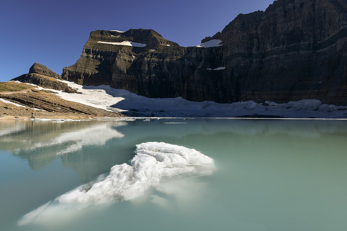 An iceberg melts in Upper Grinnell Lake below Grinnell Glacier in Glacier National Park on Thursday, Aug. 1. (Casey Kreider/Daily Inter Lake)