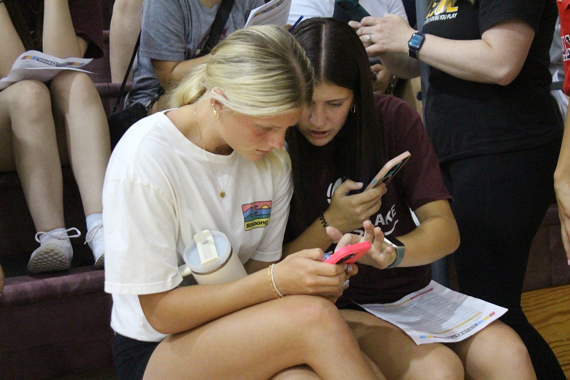 A Moses Lake student talks with a potential donor during a fundraiser to support district extracurricular activities.