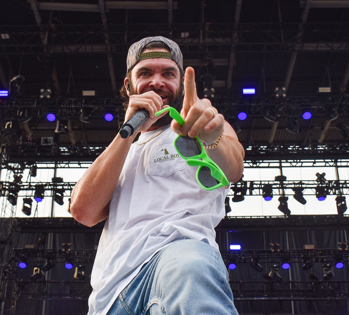 Dylan Scott brought energy to the stage Saturday evening, interacting with fans by taking their phones to take pictures, wearing items they would throw to him like sunglasses and bracelets, even wiping his sweat with a shirt that was thrown on stage and then throwing it back.