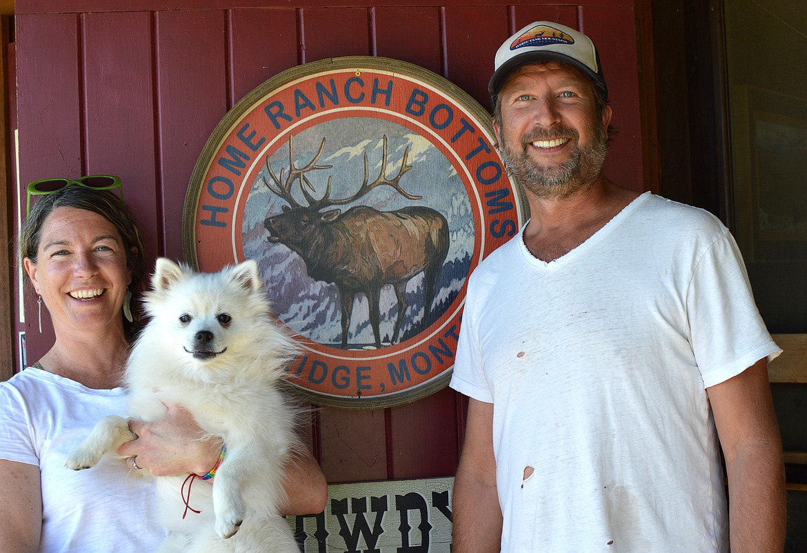 Flannery and Danny Freund, with their furry companion Yuki, at Home Ranch Bottoms in Polebridge. (Summer Zalesky/Daily Inter Lake)