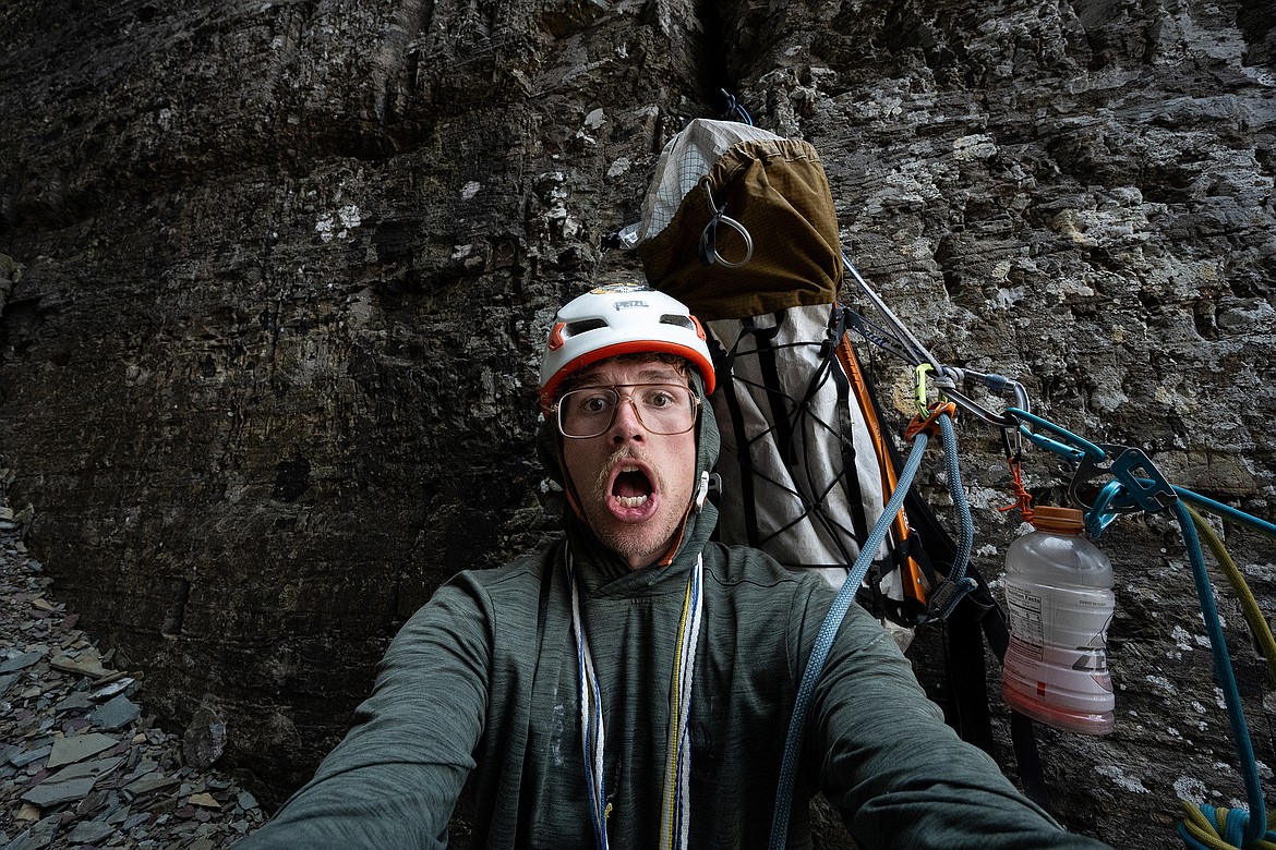 Seth Anderson takes a break, and a selfie, while belaying Adam Clark.