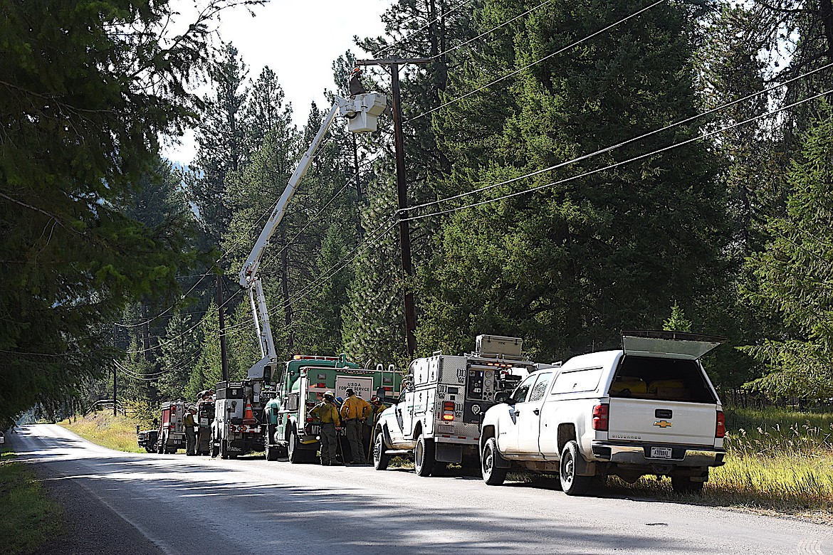 Crews from the Kootenai National Forest, Libby Volunteer Fire Department and Flathead Electric tended to a small fire early Wednesday evening on Rawlings Road just outside Libby. (Scott Shindledecker/The Western News)