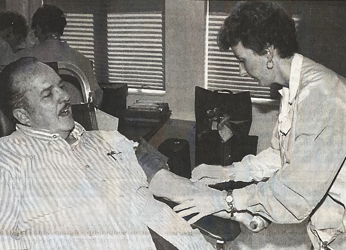 In 1994, Ron Rankin prepared to give his 100th pint of blood to the Inland Northwest Blood Center, assisted by nurse Sue Bell.