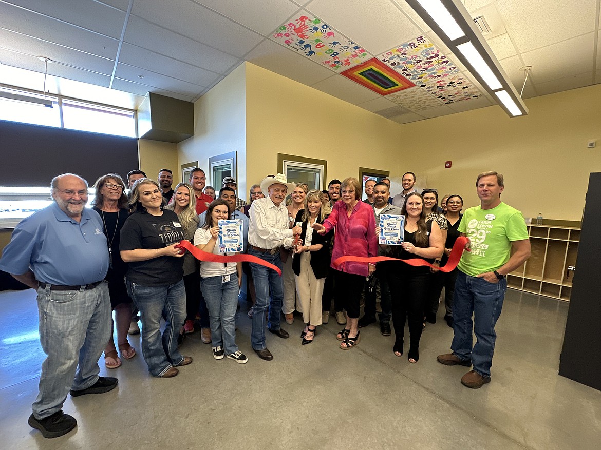 Boys & Girls Clubs of the Columbia Basin Executive Director Kim Pope and state rep. Tom Dent cut the ribbon on the club’s new Mental Health Quiet Room, flanked by state Sen. Judy Warnick, members of the club’s board and the Moses Lake Chamber of Commerce.