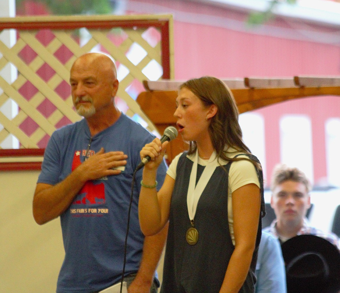 Rylie Kimball, Bonners Ferry Distinguished Young Woman, sings the national anthem at opening ceremonies at Dave Schnepf indoor arena.