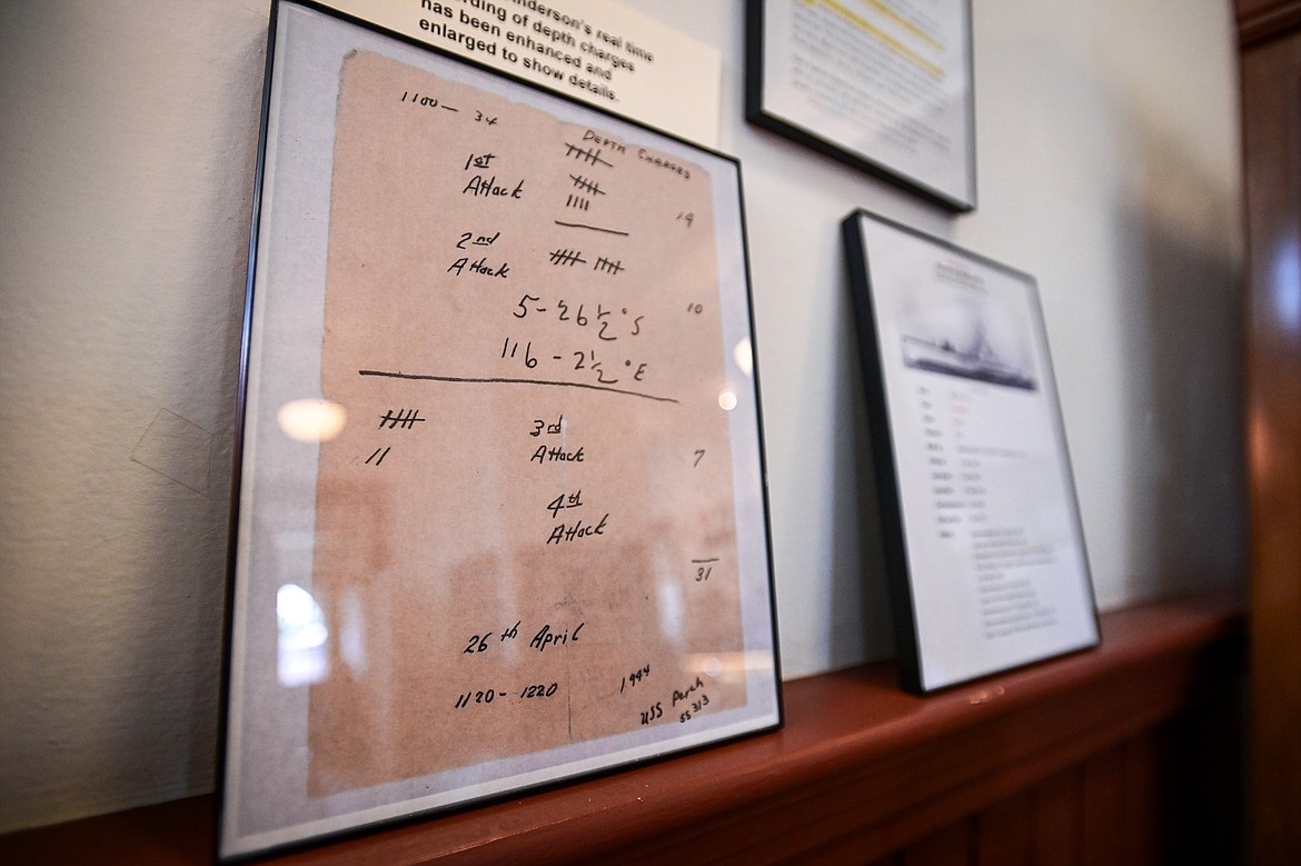 A handwritten account of Harry Anderson's real-time submarine depth charges at the Northwest Montana History Museum's new exhibit titled "The Silent Service: A WWII Diving Denizen of the Deep, Harry Martin Anderson" on Thursday, Aug. 8. (Casey Kreider/Daily Inter Lake)