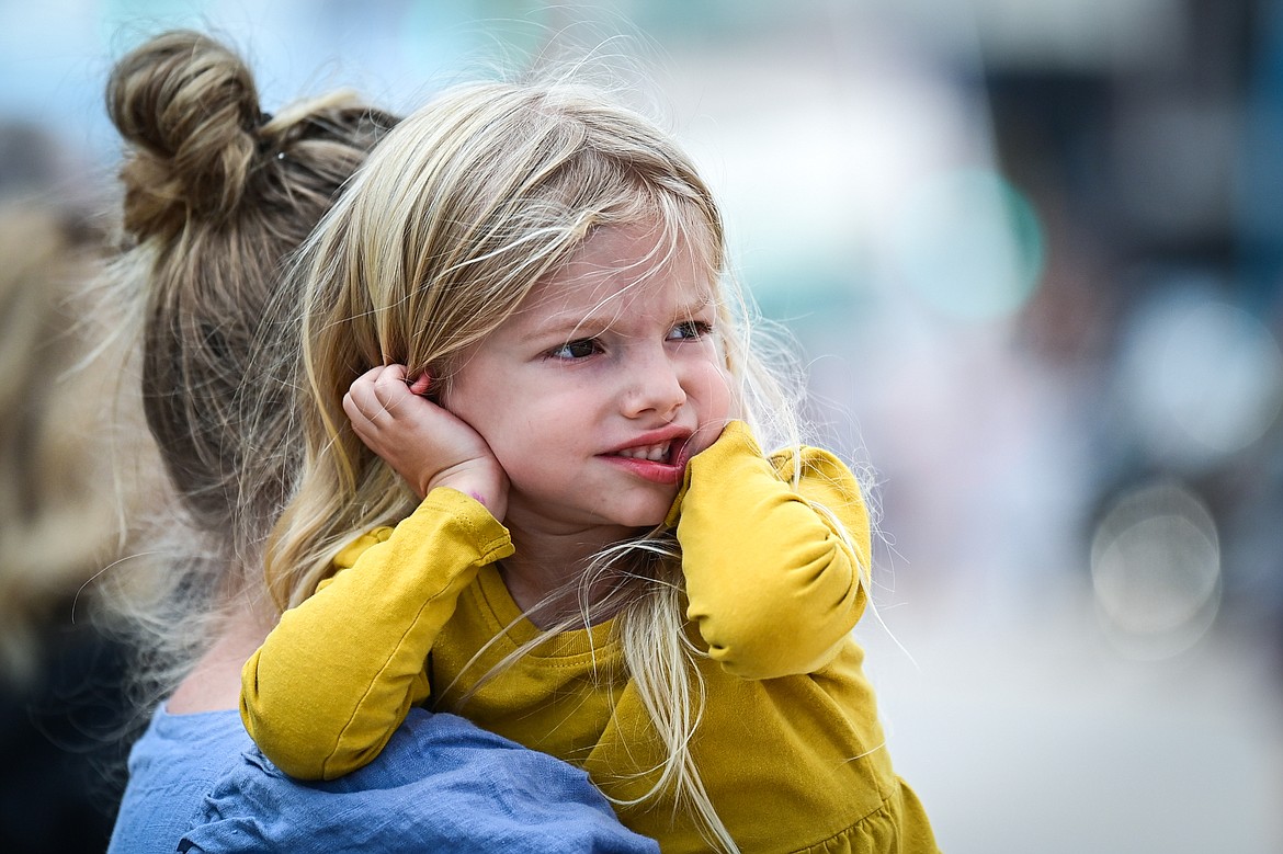 A young girl puts her hands over her ears during the Northwest Montana Fair Parade in Kalispell on Friday, Aug. 9. (Casey Kreider/Daily Inter Lake)