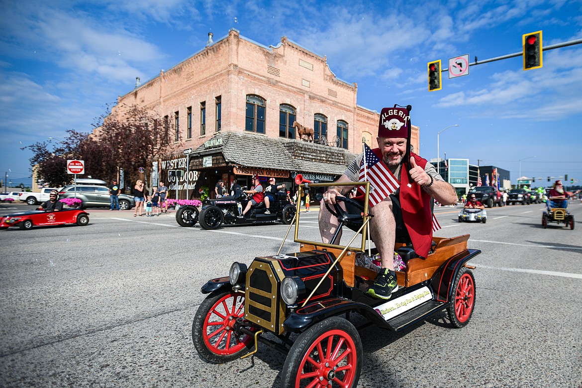 Members of the Flathead Shrine Club hand out candy during the Northwest Montana Fair Parade in Kalispell on Friday, Aug. 9. (Casey Kreider/Daily Inter Lake)