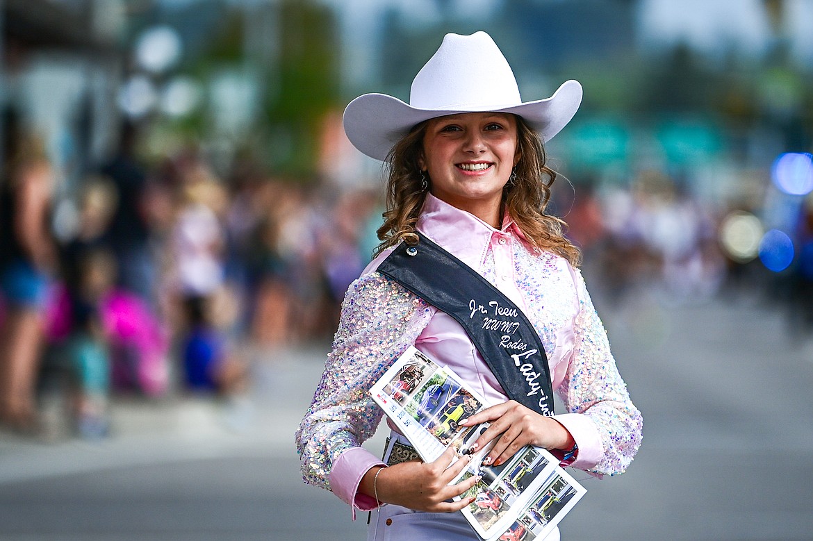 Vayda Kauffman, 2024 Junior Teen Northwest Montana Rodeo walks down Main Street during the Northwest Montana Fair Parade in Kalispell on Friday, Aug. 9. (Casey Kreider/Daily Inter Lake)