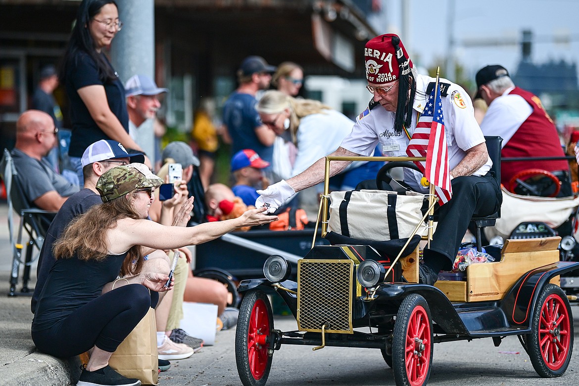 Members of the Flathead Shrine Club hand out candy during the Northwest Montana Fair Parade in Kalispell on Friday, Aug. 9. (Casey Kreider/Daily Inter Lake)