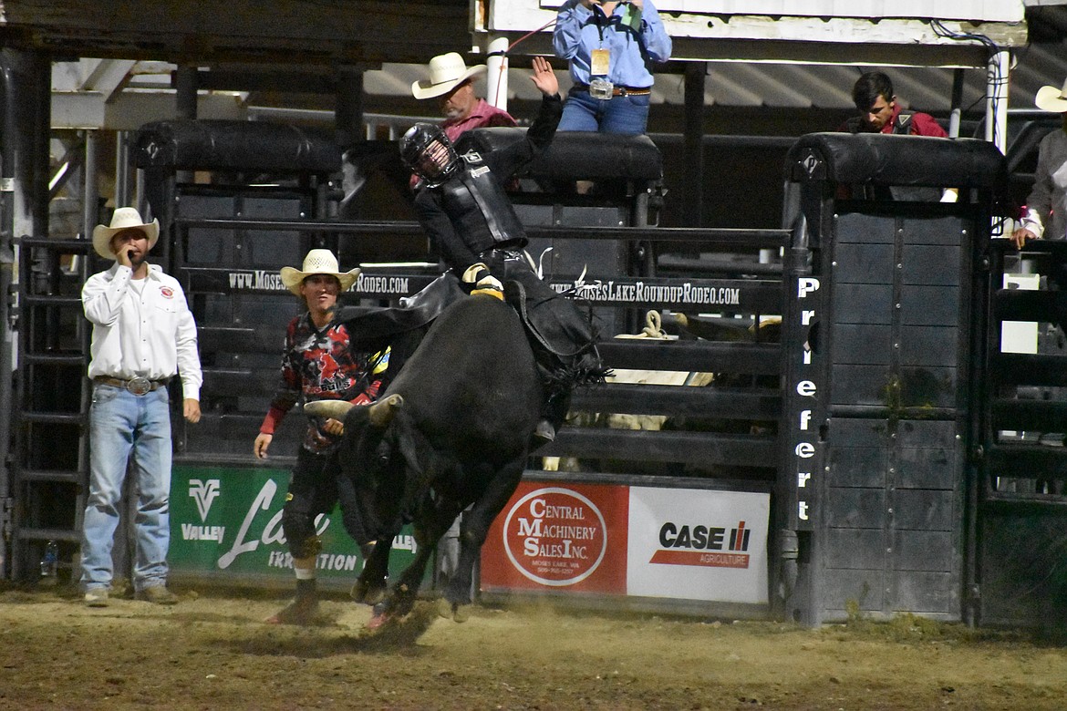 Bull rider Trevor Reiste of Linden, Iowa keeps his balance on top of the bull Make My Day at last year’s Moses Lake Roundup Rodeo. This year’s rodeo begins Thursday.