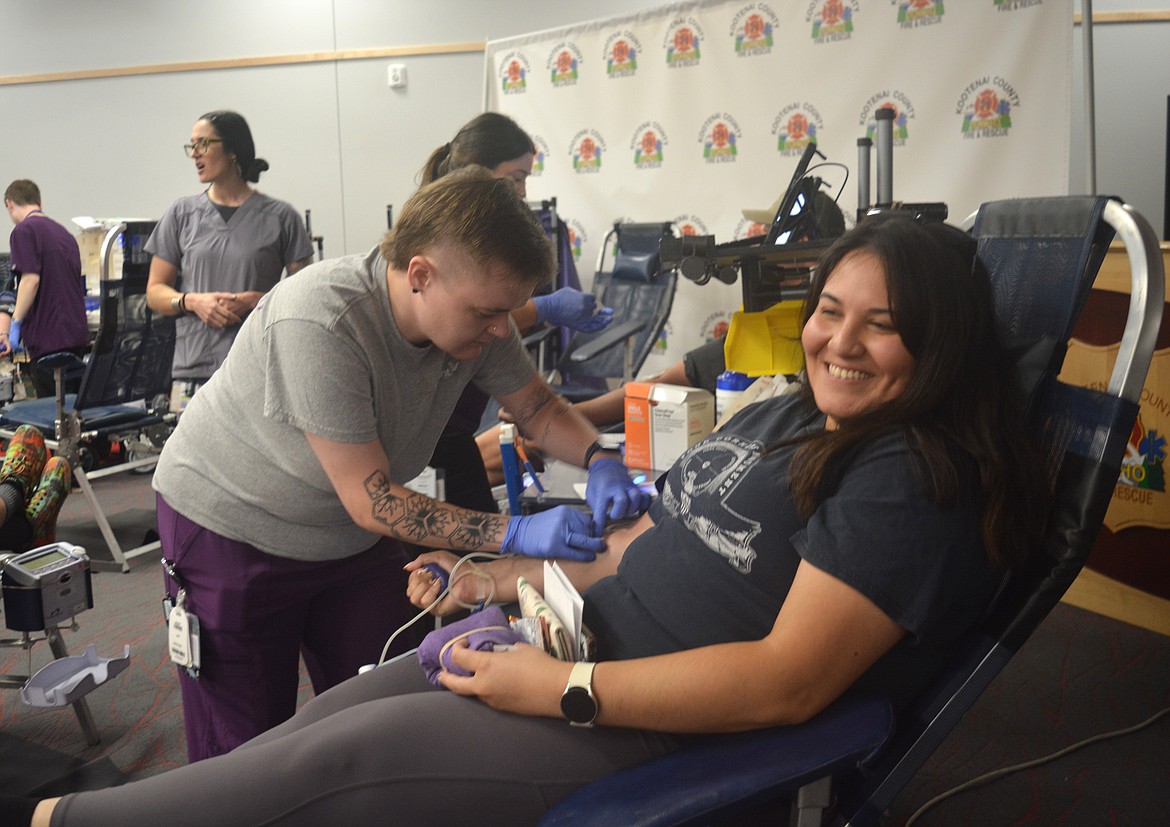 Elba Rodriguez, a dispatcher for Post Falls Police Department has blood drawn by phlebotomist Brook Tarbert Thursday at Kootenai County Fire and Rescue.