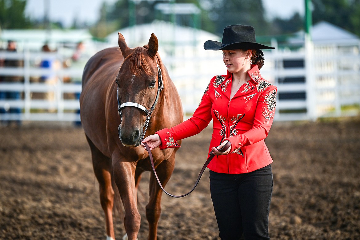 Emily Tuck leads her horse through the pattern during junior level showmanship at the 4H Horse Show at the Northwest Montana Fair on Saturday, Aug. 10. (Casey Kreider/Daily Inter Lake)