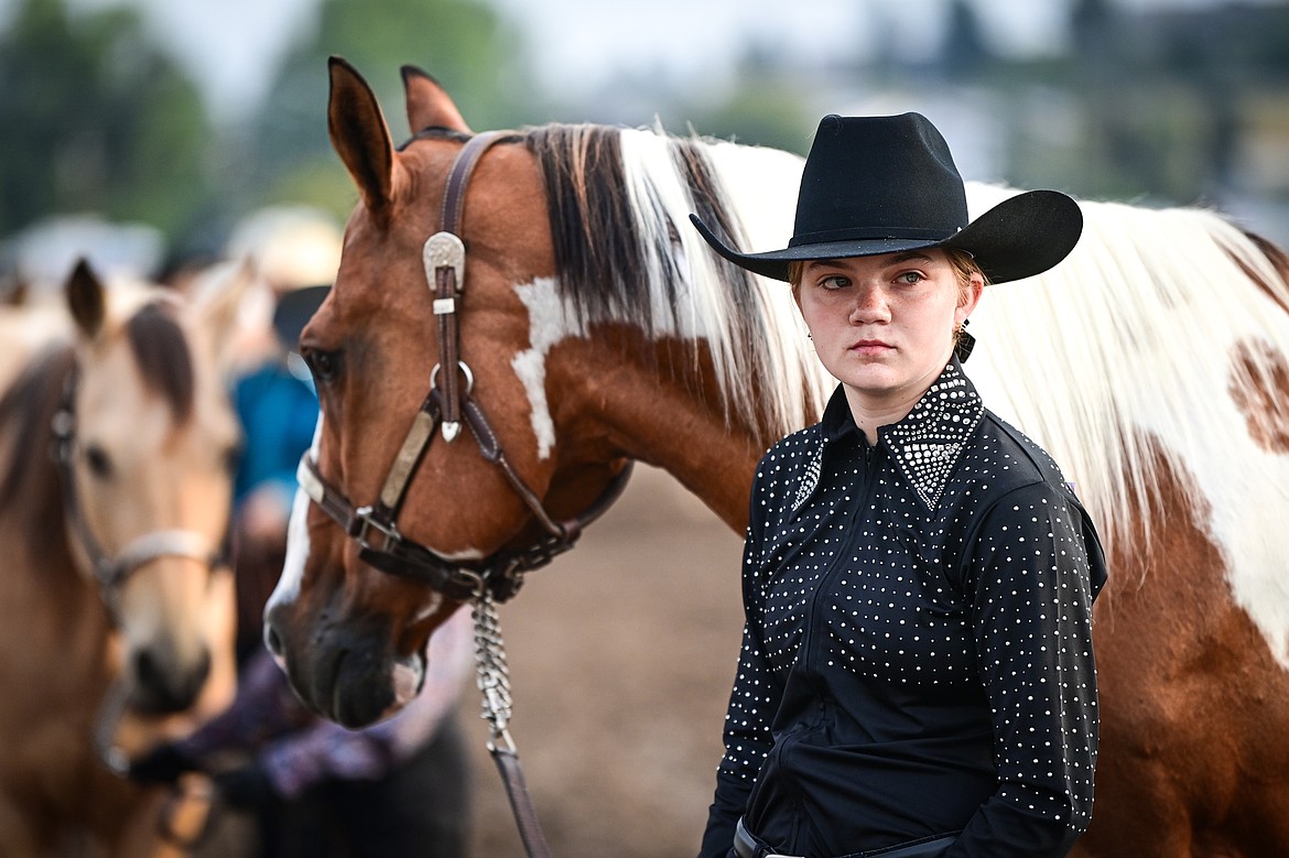 Addy Aiken waits to show her horse during junior level showmanship at the 4H Horse Show at the Northwest Montana Fair on Saturday, Aug. 10. Aiken won grand champion in her division. (Casey Kreider/Daily Inter Lake)