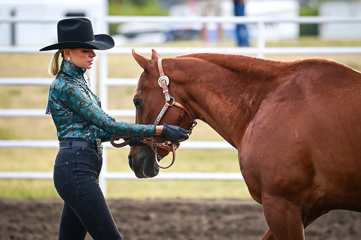 Quindy Gronley leads her horse through the pattern during senior level showmanship at the 4H Horse Show at the Northwest Montana Fair on Saturday, Aug. 10. Gronley won grand champion in her division. (Casey Kreider/Daily Inter Lake)