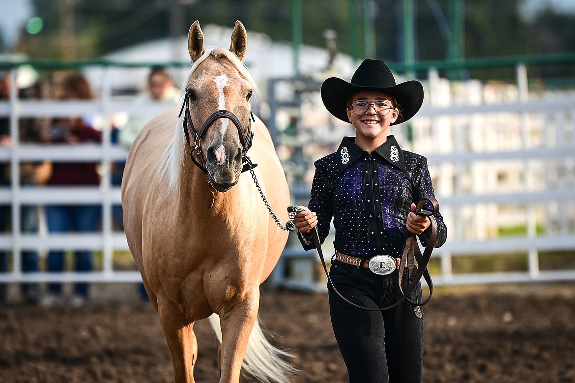 Emily Stolfus leads her horse through the pattern during junior level showmanship at the 4H Horse Show at the Northwest Montana Fair on Saturday, Aug. 10. (Casey Kreider/Daily Inter Lake)