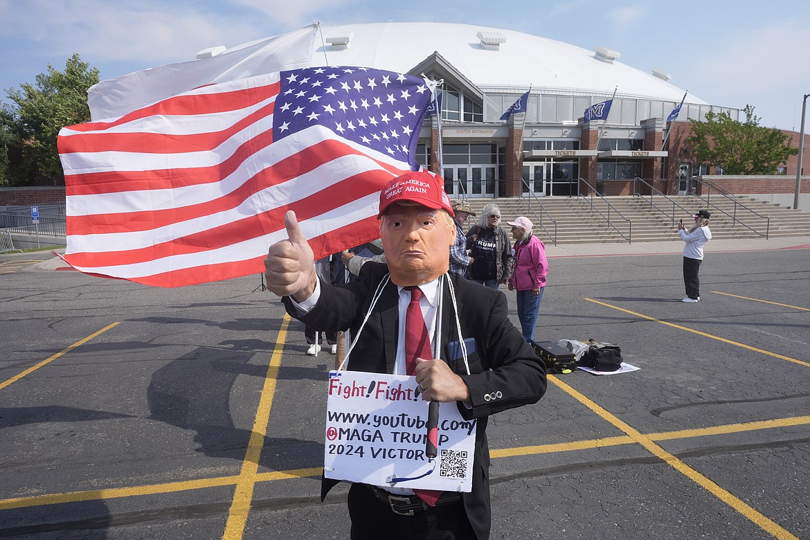 People wait in line before a campaign rally for Republican presidential nominee former President Donald Trump, in Bozeman, Mont., Friday, Aug. 9, 2024. (AP Photo/Rick Bowmer)