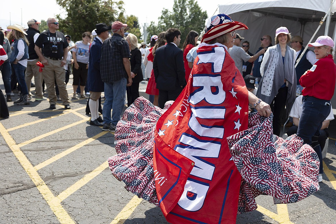 Susan Reneau, 72, of Missoula, Mont., arrives before Republican presidential nominee former President Donald Trump speaks at a campaign rally in Bozeman, Mont., Friday, Aug. 9, 2024. (AP Photo/Janie Osborne)