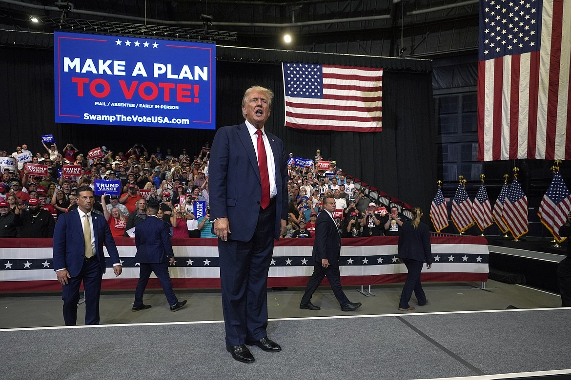 Republican presidential nominee former President Donald Trump talks after speaking at a campaign rally in Bozeman, Mont., Friday, Aug. 9, 2024. (AP Photo/Rick Bowmer)