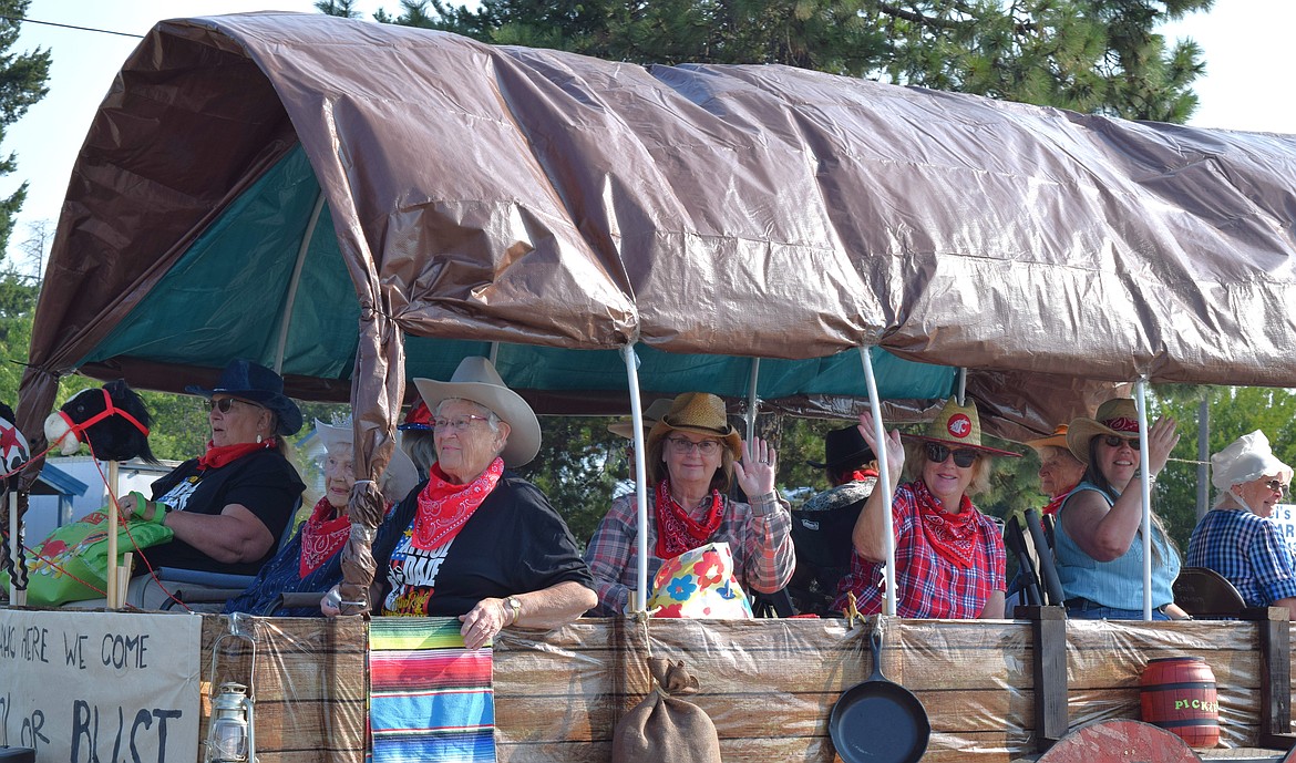 The ladies of the Athol Grandmother's Club smile and wave to the families along the parade route.