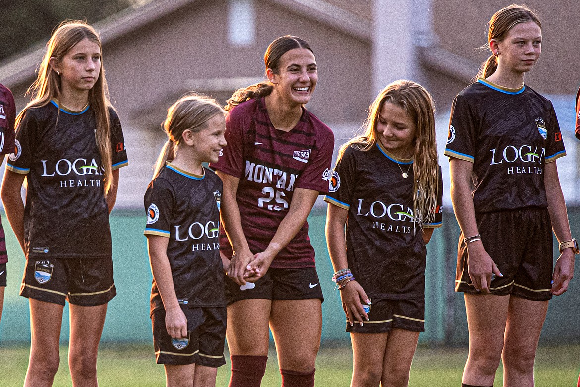 Grizzly Carly Whalen welcomes local players alongside her as the starting lineup is announced for the Gonzanga-Montana exhibition game in Columbia Falls Sunday, August 11. (Avery Howe/Bigfork Eagle)