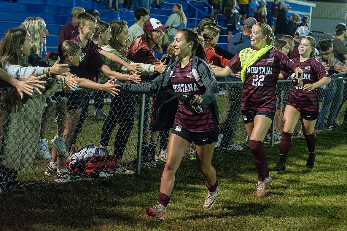 Grizzlies Kayla Rendon Bushmaker, Reagan Brisendine and Maddie Ditta greet fans after the Gonzaga-Montana exhibition game in Columbia Falls Sunday, August 11. (Avery Howe/Bigfork Eagle)