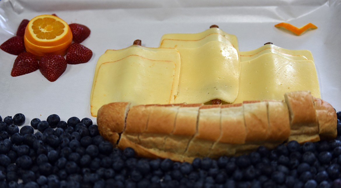 A French bread boat floats on a blueberry sea at the Edible Book Festival, an event hosted by the Whitefish Community Library. (Julie Engler/Whitefish Pilot)